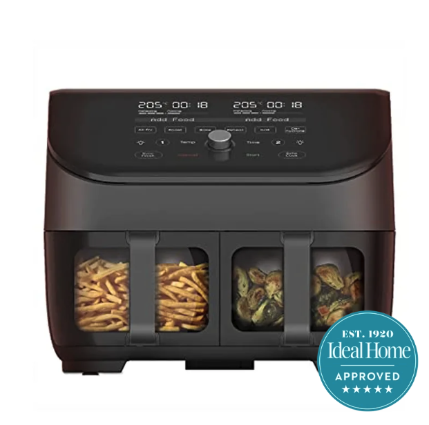 Grey two basket air fryer with viewing windows on the baskets on a white background. An Ideal Home 5 star approved badge is in the right hand corner