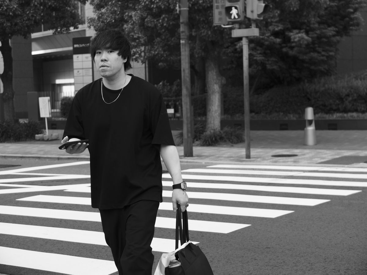 Sample image taken with the Panasonic Lumix L10; man crossing the road in Osaka street
