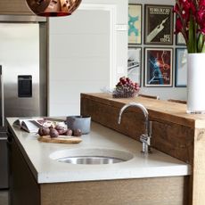 kitchen with marble worktop and sink with tap