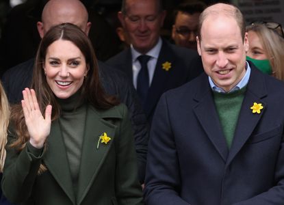 Catherine, Duchess of Cambridge waves to well-wishers during a visit to Abergavenny Market with Prince William, Duke of Cambridge