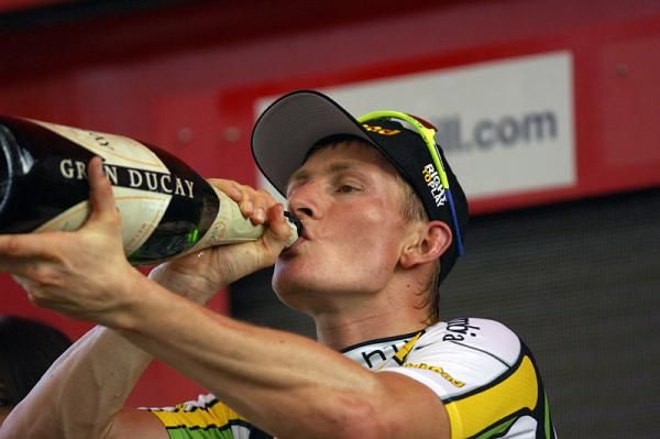 Andr&eacute; Greipel enjoys a sip of champagne on the podium.