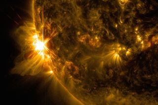 A massive X2.2 solar flare erupts off the left limb of the sun in this view captured by NASA's Solar Dynamics Observatory on June 10, 2014, at 7:41 a.m. EDT.