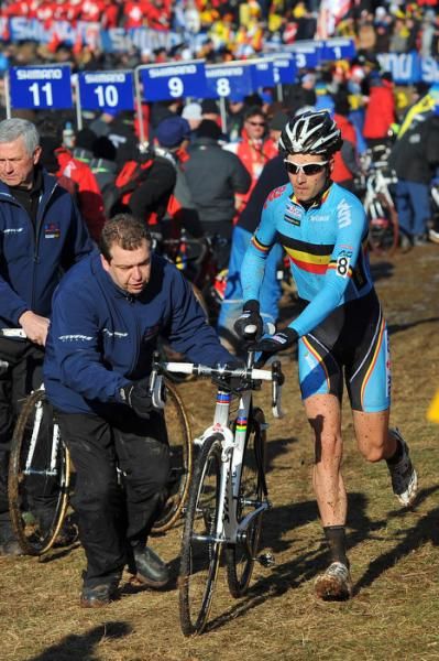 Niels Albert (Belgium) runs through the pits.