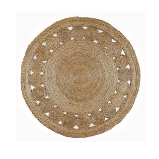 A round jute rug with cutouts