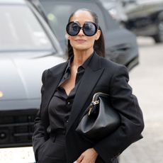 a black woman photographed during paris fashion week