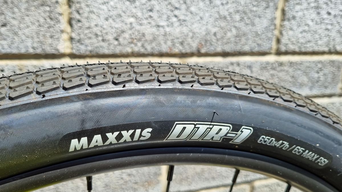 A close up of some Maxxis DTR-1 tyres with a semi-slick tread