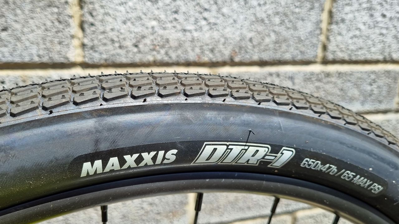 A close up of some Maxxis DTR-1 tyres with a semi-slick tread