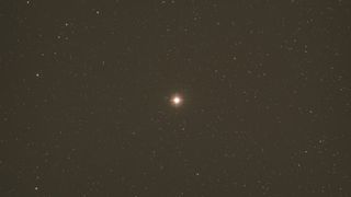 pollux star shines brightly against a background of fainter stars.