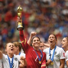 Women's Soccer team holding up trophy