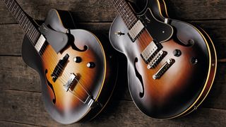 Pair of Godin guitars resting on wooden floorboards