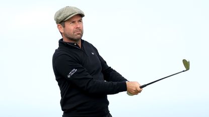 Robert Rock of England plays his second shot on the fifth hole on day two of the Alfred Dunhill Links Championship 2024 at Kingsbarns Golf Club on October 04, 2024 in Kingsbarns, Scotland.