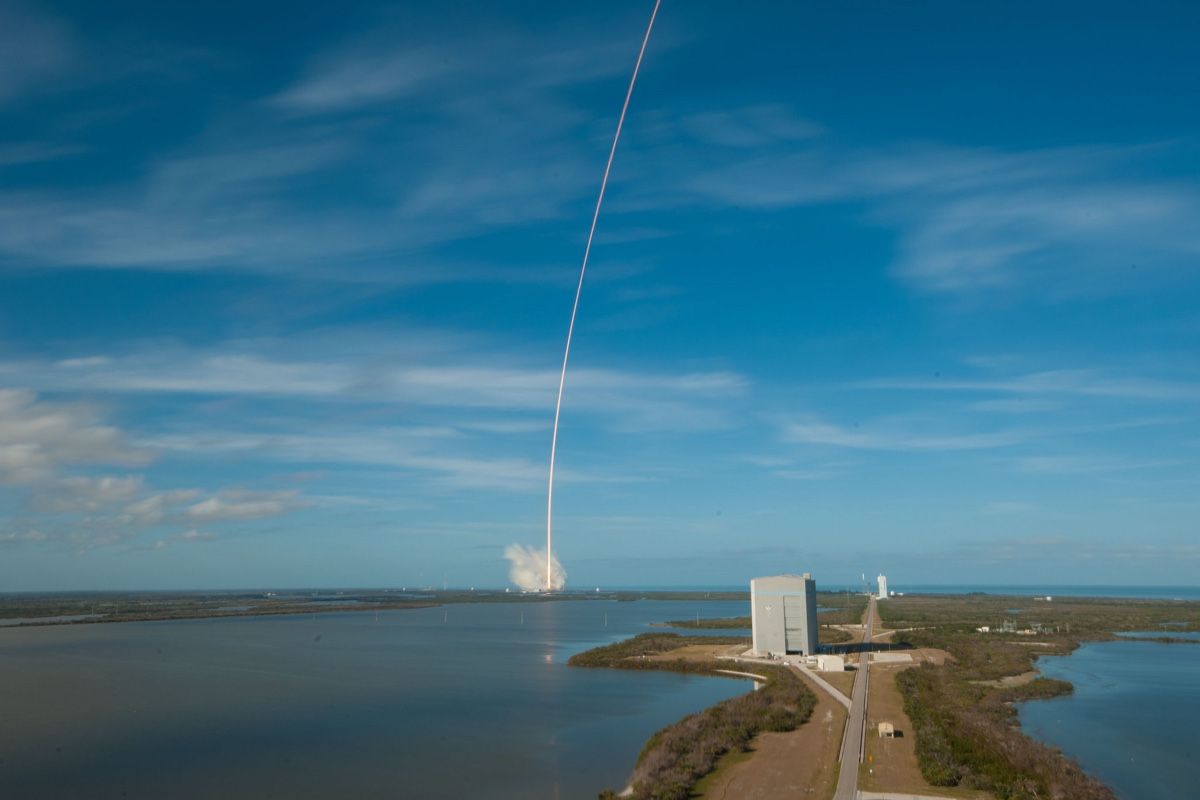 A long-exposure photo of the Falcon Heavy rocket&#039;s first test launch on Feb. 6, 2018 shows the rocket&#039;s curved trajectory as it lifts off from Kennedy Space Center and heads toward low-Earth orbit.