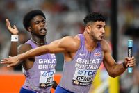 BUDAPEST, HUNGARY - AUGUST 25: Jeremiah Azu of GB hands the baton to Adam Gemili of Team Great Britain in the Men's 4x100m Relay Heats during day seven of the World Athletics Championships Budapest 2023 at National Athletics Centre on August 25, 2023 in Budapest, Hungary. (Photo by Shaun Botterill/Getty Images)