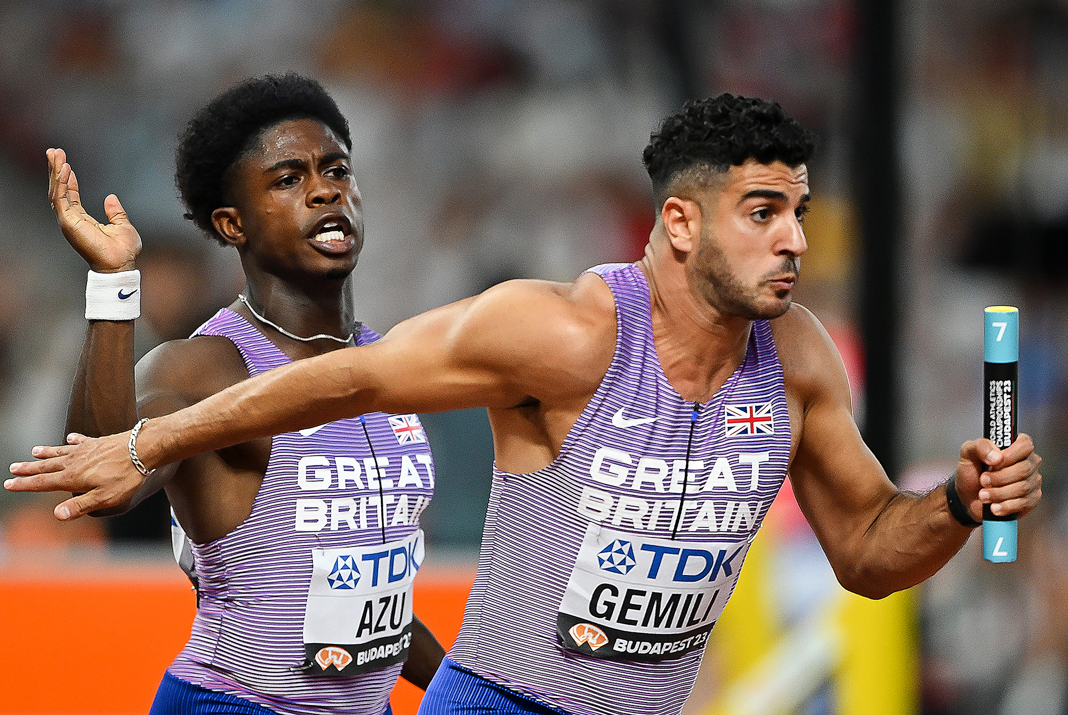 BUDAPEST, HUNGARY - AUGUST 25: Jeremiah Azu of GB hands the baton to Adam Gemili of Team Great Britain in the Men&amp;apos;s 4x100m Relay Heats during day seven of the World Athletics Championships Budapest 2023 at National Athletics Centre on August 25, 2023 in Budapest, Hungary. (Photo by Shaun Botterill/Getty Images)