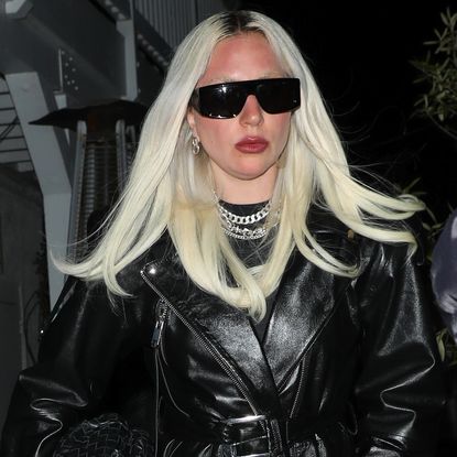 Lady Gaga wears a leather trench and sunglasses while leaving her birthday dinner