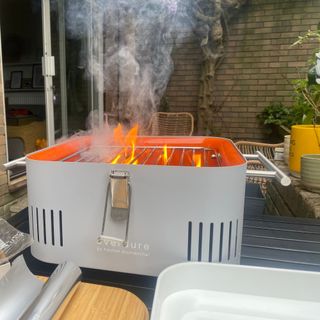 Everdure Cube BBQ lit with flames