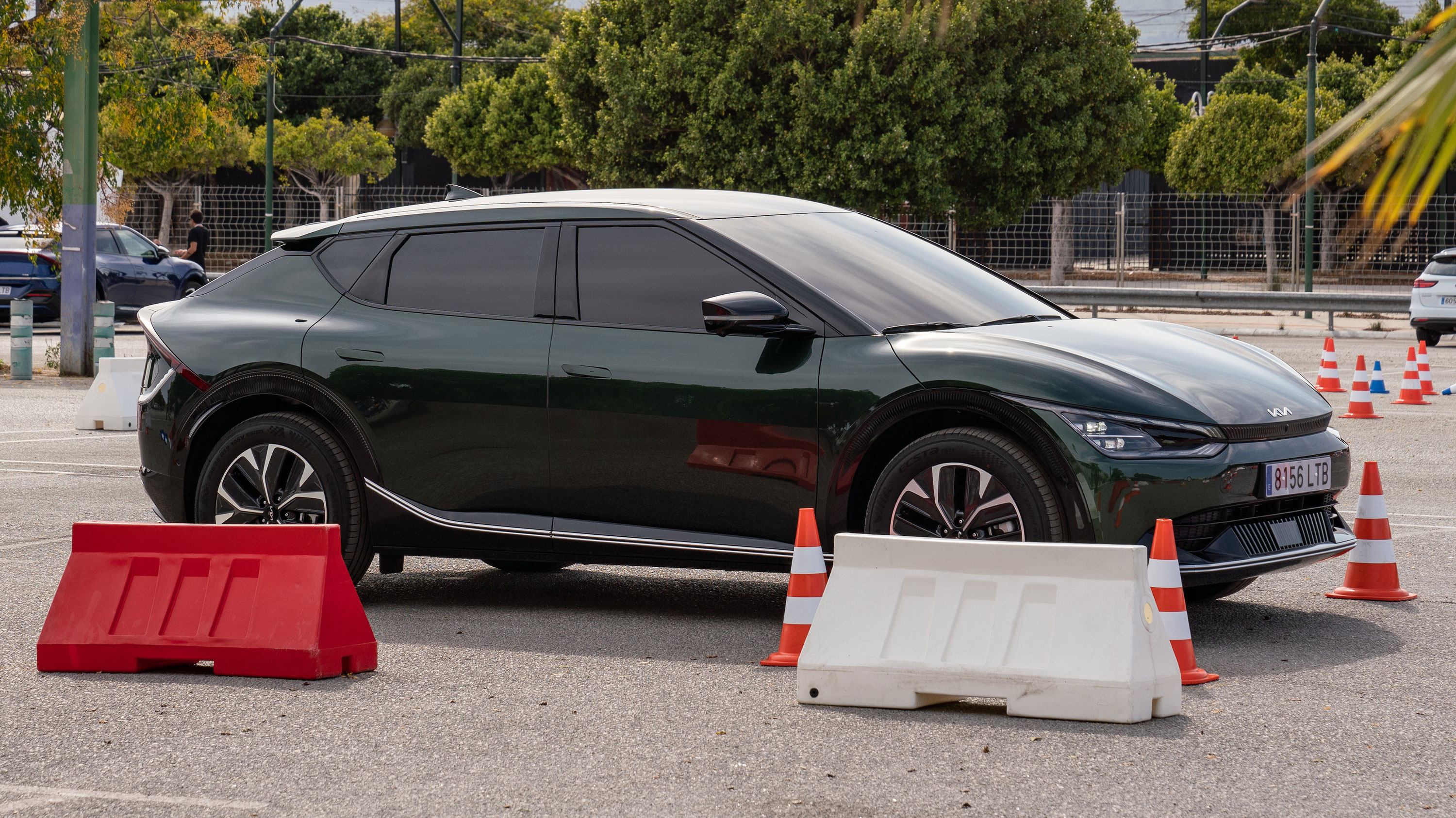 Kia EV6 driving round a course in a parking lot