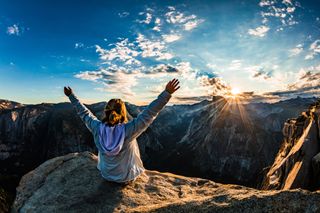 Yosemite National Park, Yosemite Valley, Young woman with raised hands
