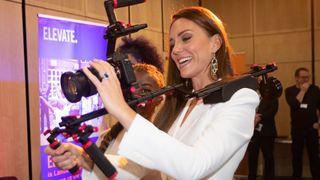 Kate Middleton holding a camera