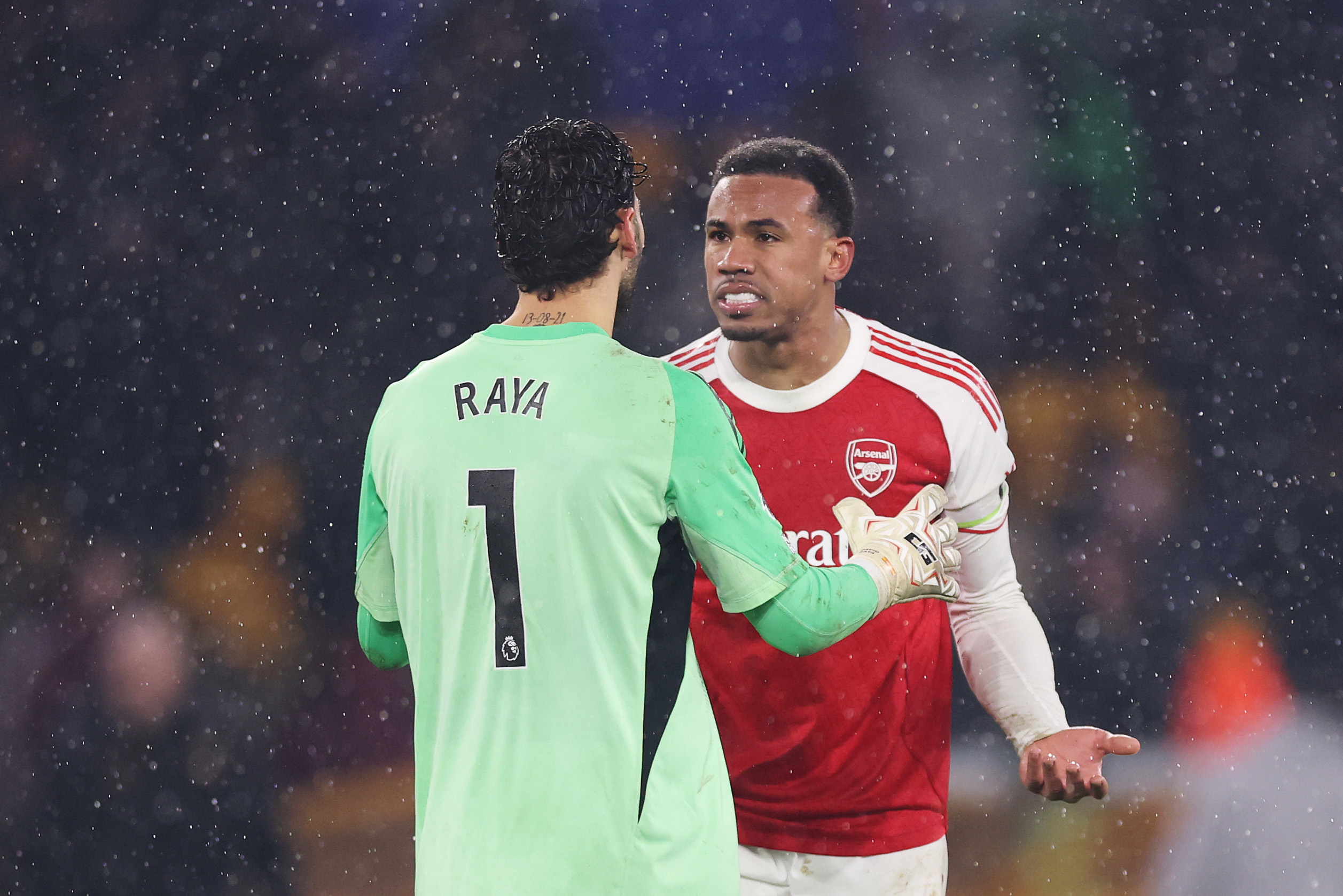 David Raya and Gabriel of Arsenal clash after Tom Edozie of Wolverhampton Wanderers (not pictured) scores his team's second goal during the Premier League match between Wolverhampton Wanderers and Arsenal at Molineux on February 18, 2026 in Wolverhampton, England.