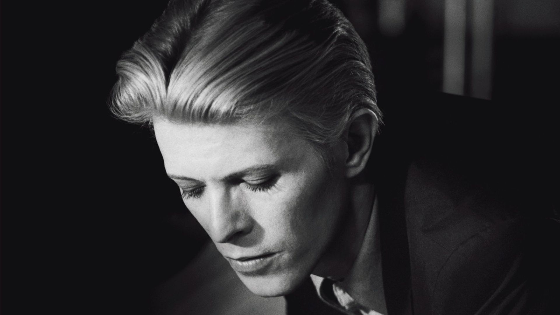 a portrait of David Bowie in black and white shot by Geoff MacCormack who will be one of the speakers at the event