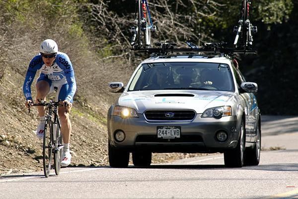 Ellis riding shotgun with Vaughters at the Tour of California