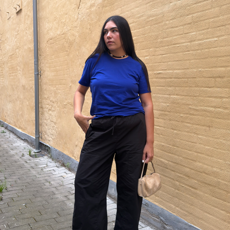 Who What Wear editor Ana Escalante wearing and reviewing LESET Kyoto Carpenter Pants.