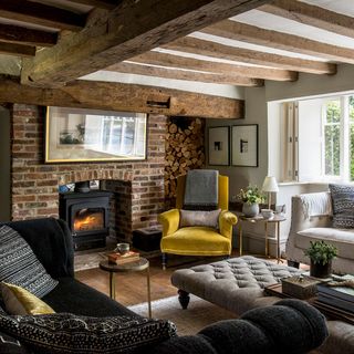 Living room with fireplace and brick wall