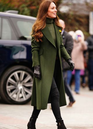 Kate Middleton wearing a green coat.
