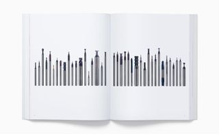 View of two pages inside the 'Designed by Apple in California' book featuring photos of various tungsten carbide cutting tools
