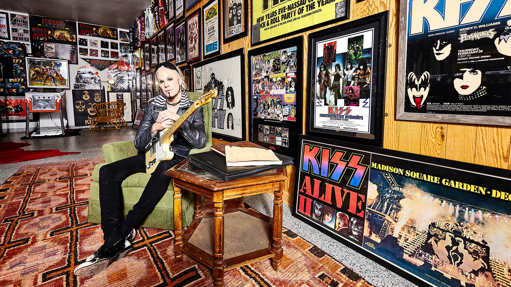 John 5 poses in his Knights in Satan's Service Museum of Kiss Memorabilia
