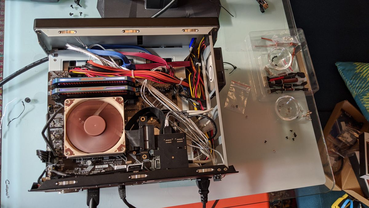 The build mostly completed, with SATA expansion board installed. The space in front of the 60mm fan is mostly clear.