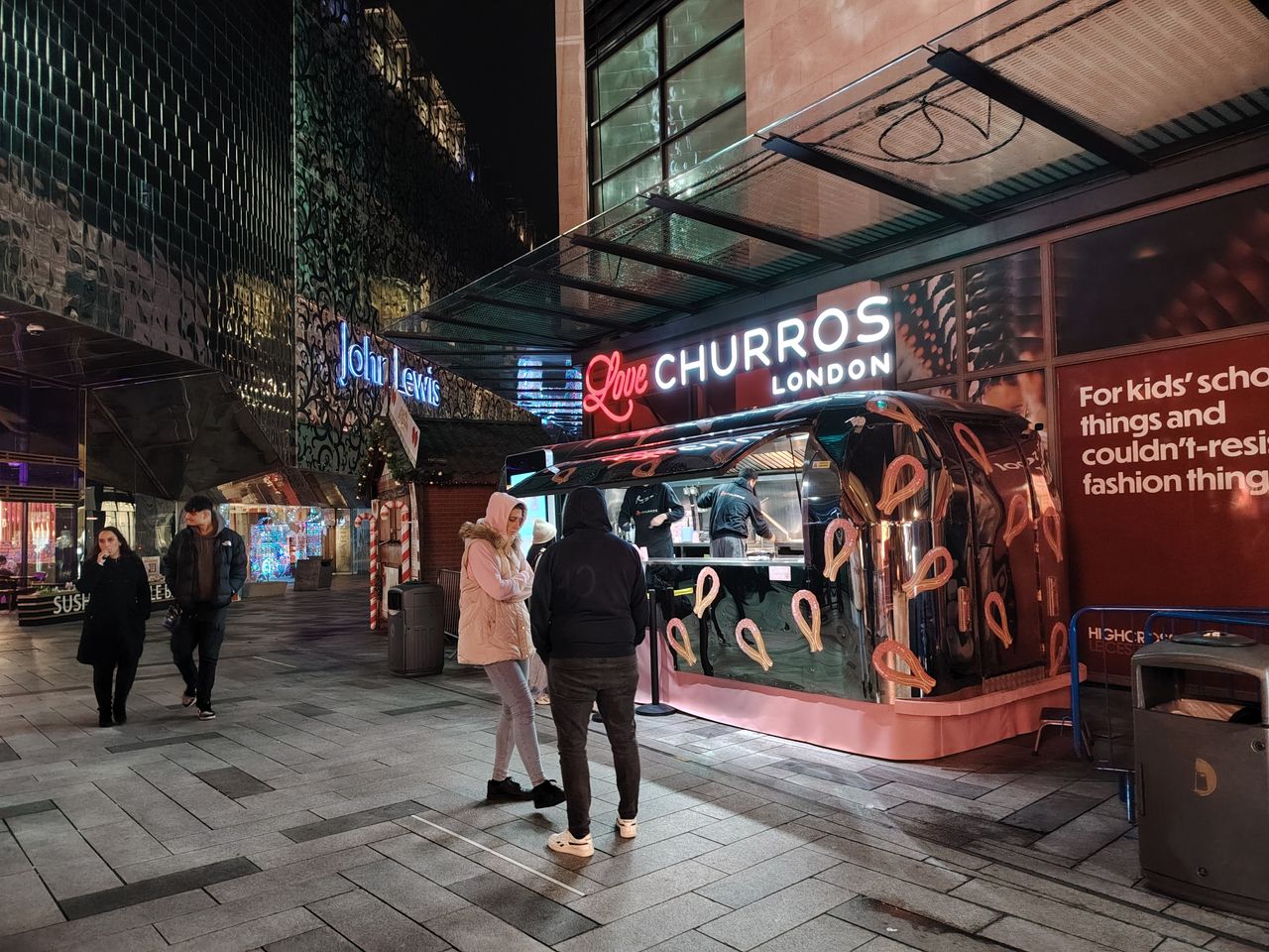 Exterior of a large shopping centre at night