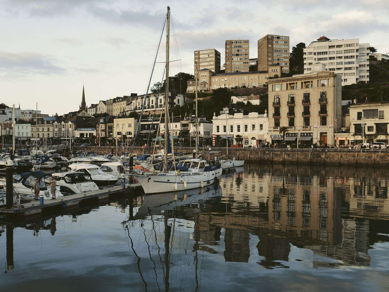 Sample image taken with the Panasonic Lumix L10; a sail boat in a harbour, the water is still, it's golden hour