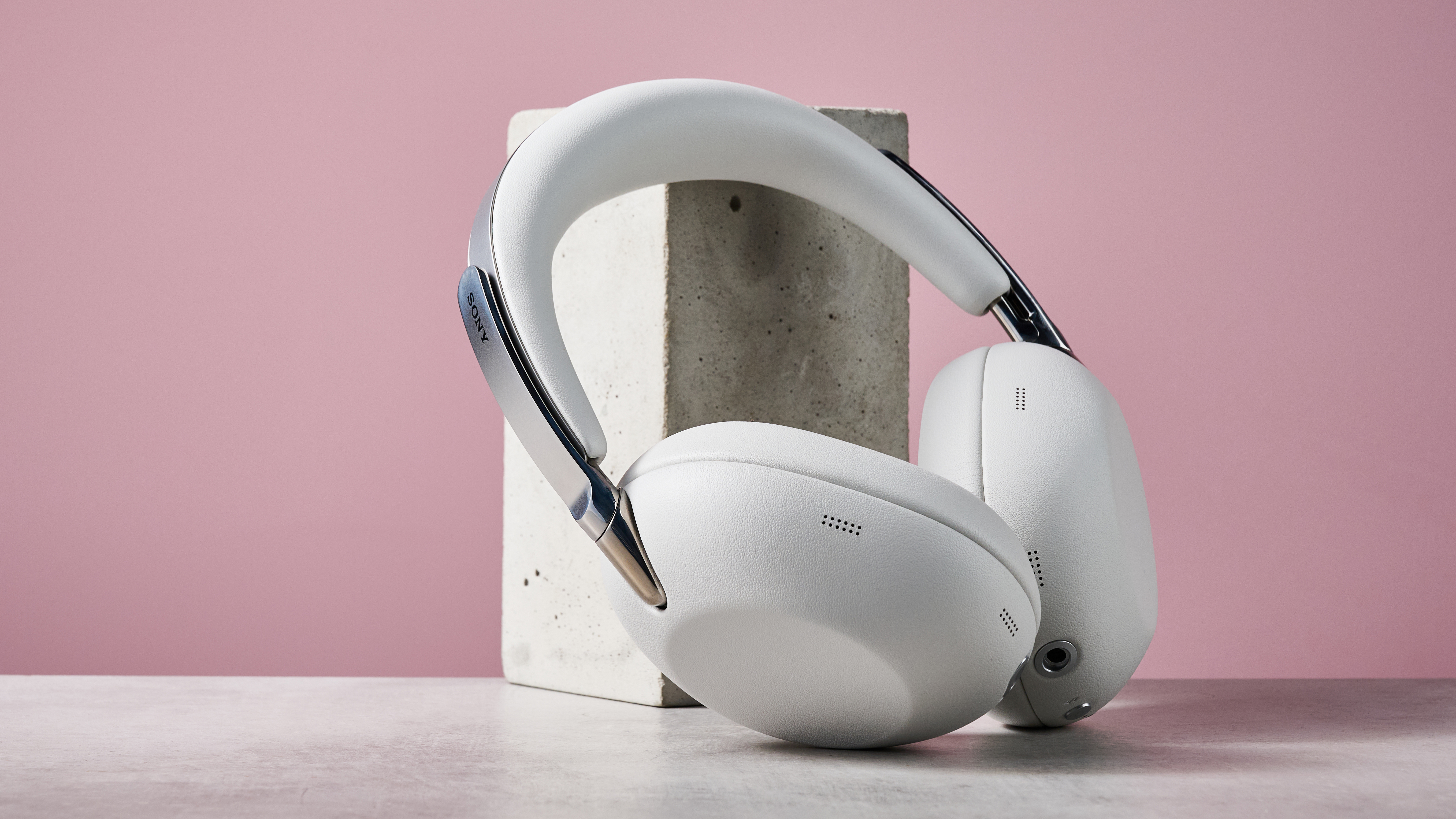 Sony 1000X The Collexion headphones leaning on a stone block