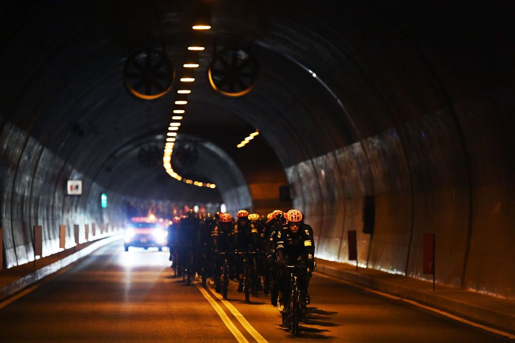 CORTINA DAMPEZZO ITALY MAY 24 Julius van den Berg of Belgium and Team EF Education Nippo leads the peloton passing through tunnel landscape during the 104th Giro dItalia 2021 Stage 16 a 153km stage shortened due to bad weather conditions from Sacile to Cortina dAmpezzo 1210m Detail view girodiitalia Giro on May 24 2021 in Cortina dAmpezzo Italy Photo by Tim de WaeleGetty Images