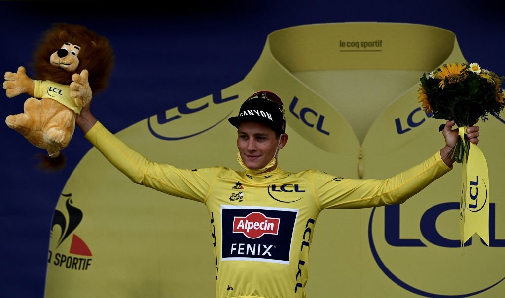 TOPSHOT Team Alpecin Fenix Mathieu van der Poel of Netherlands celebrates his overall leader yellow jersey on the podium at the end of the 5th stage of the 108th edition of the Tour de France cycling race a 27 km time trial between Change and Laval on June 30 2021 Photo by Philippe LOPEZ AFP Photo by PHILIPPE LOPEZAFP via Getty Images