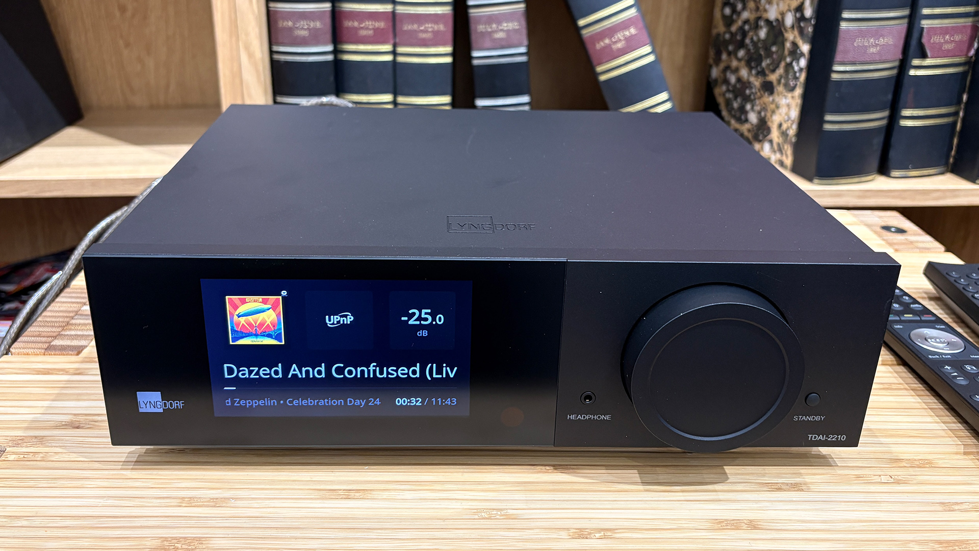 Lyngdorf TDAI-2210 streaming amplifierLyngdorf TDAI-2210 streaming amplifier on wooden hi-fi rack in front of bookcase