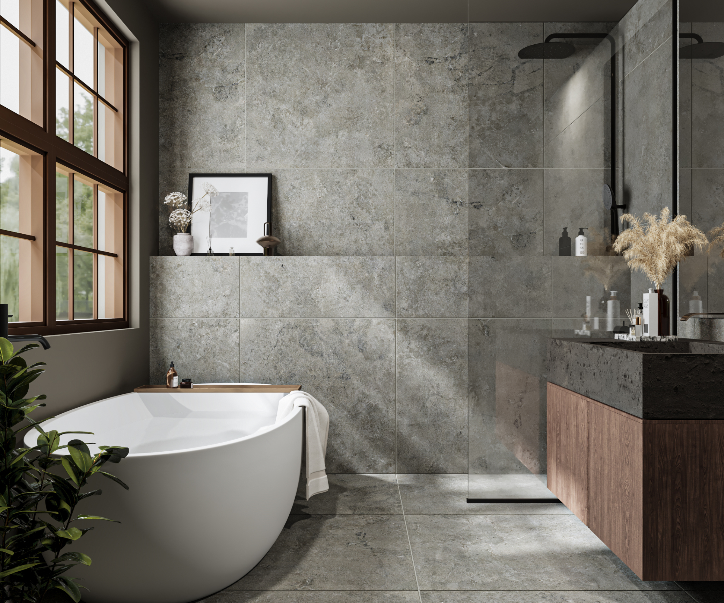 grey tiled bathroom with large white freestanding bath