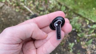 a closeup of the nothing ear 1 wireless earbuds