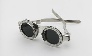Solid silver sculptural frame with a series of seven interchangeable tinted lenses