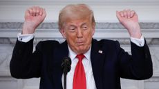 WASHINGTON, DC - JULY 14: While discussing biological males competing in female sports, U.S. President Donald Trump talks about lifting weights while delivering remarks during a White House Faith Office luncheon in the State Dining Room at the White House on July 14, 2025 in Washington, DC. Pastor Paula White-Cain, the head of the White House Faith Office, hosted the luncheon with members of the government, faith-based, and community organizations.