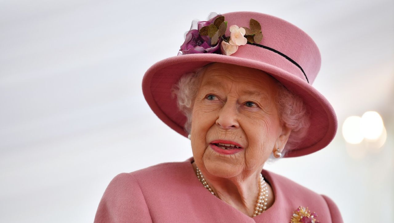 The Queen speaks with staff during a visit to the Defence Science and Technology Laboratory (Dstl) at Porton Down science park on October 15, 2020 near Salisbury, England. 