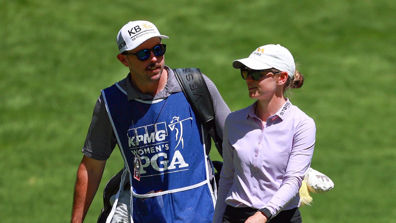 Sarah Schmelzel with caddie Kyle Alexander