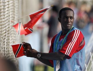 Trinidad and Tobago forward Dwight Yorke signs autographs for fans during a training session at the 2006 World Cup in Germany.