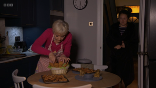 Jean Slater makes a 'fishy basket' as an unimpressed Stacey watches on