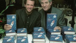 Author Yann Martel pictured next to stacks of his book 'Life of Pi', in German language