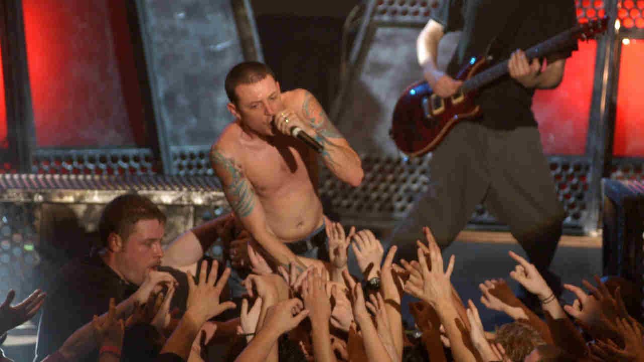 Linkin Park’s Chester Bennington performing onstage in 2003
