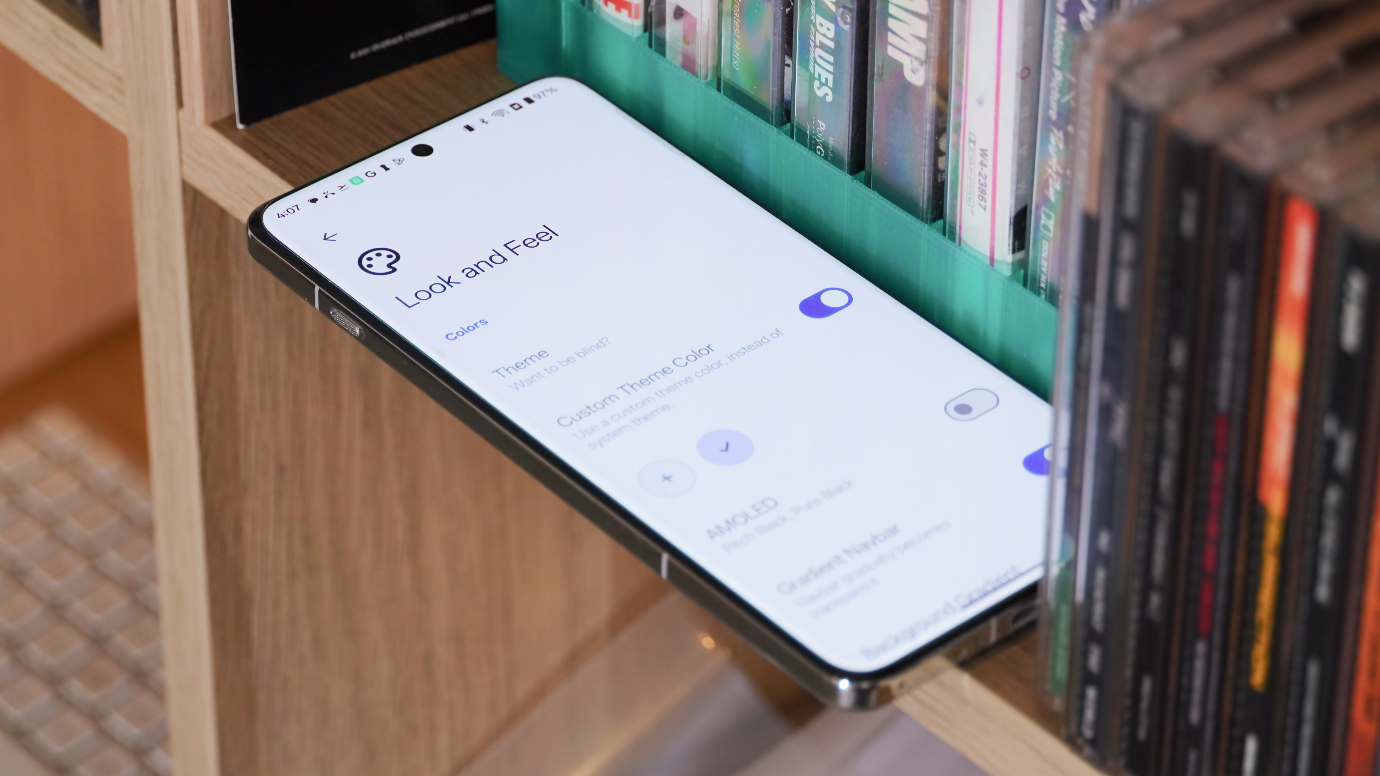 Music player apps running on various Android phones and iPhones.