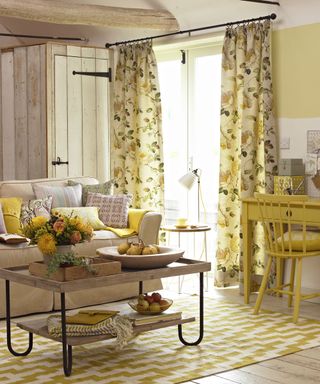 living room with yellow study table and chair and wooden flooring